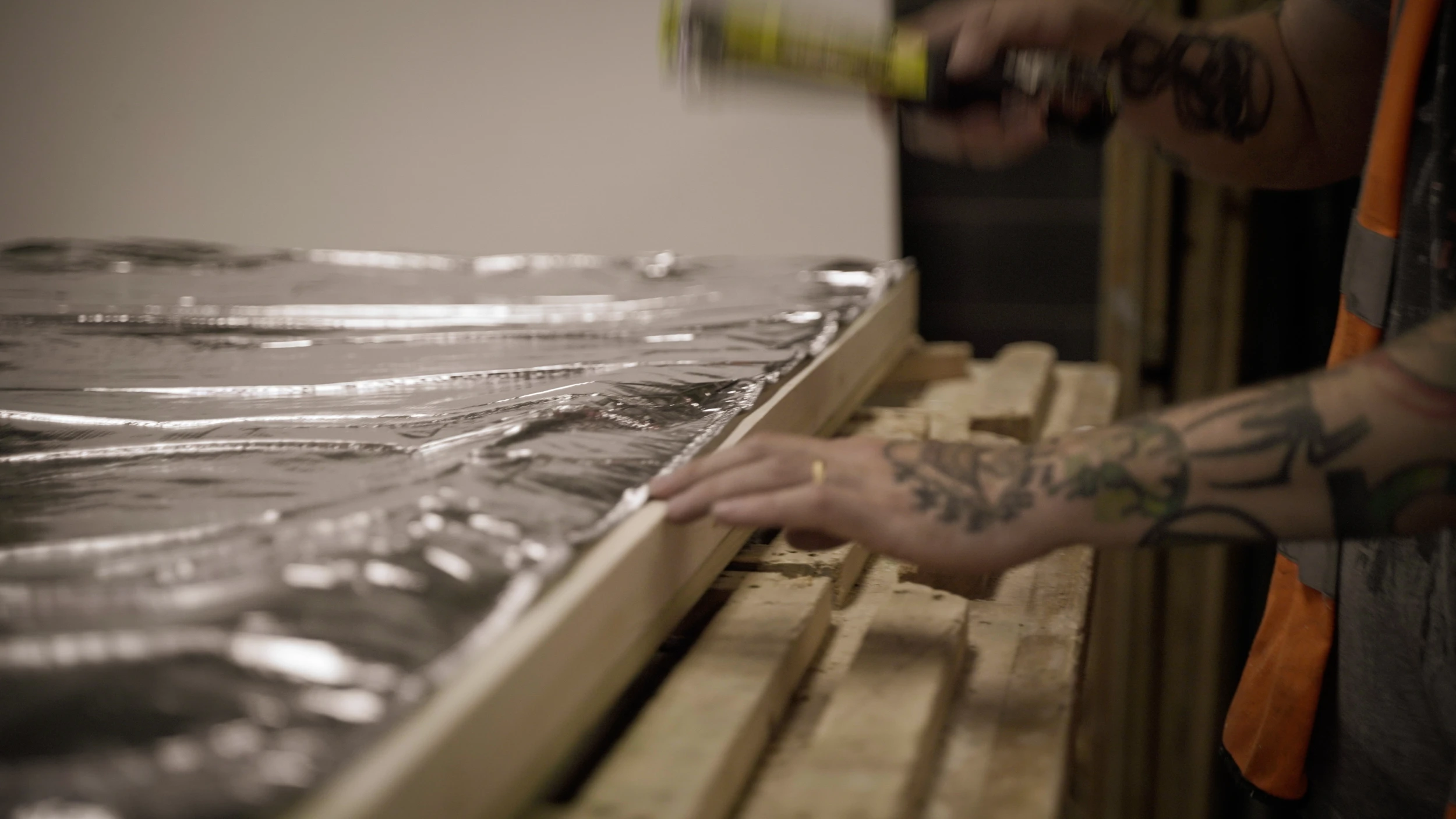 A worker fitting insulation in Project Timber's Nottinghamshire workshop